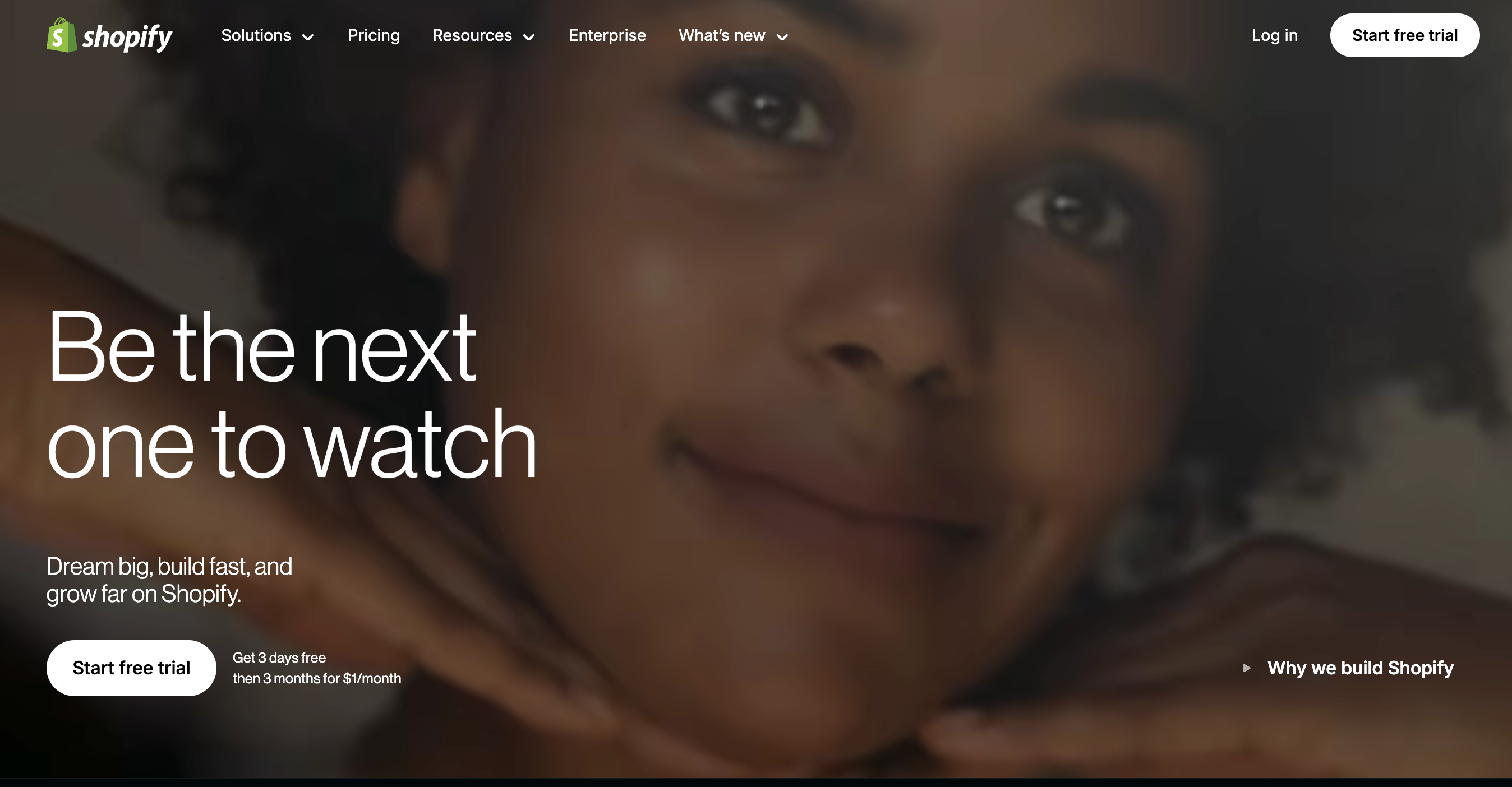 Shopify's homepage features its logo in the top left corner.