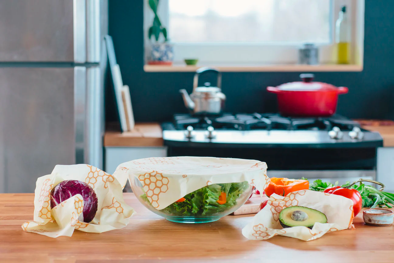 Bee’s Wrap reusable food wrappers—a niche market example—covering fresh produce on a kitchen countertop.