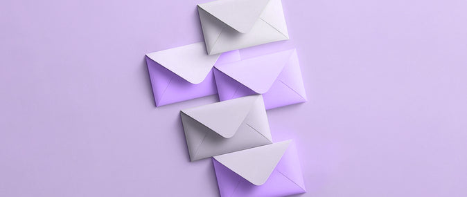 four envelopes that overlap and fall diagonally from left to right: bulk email service