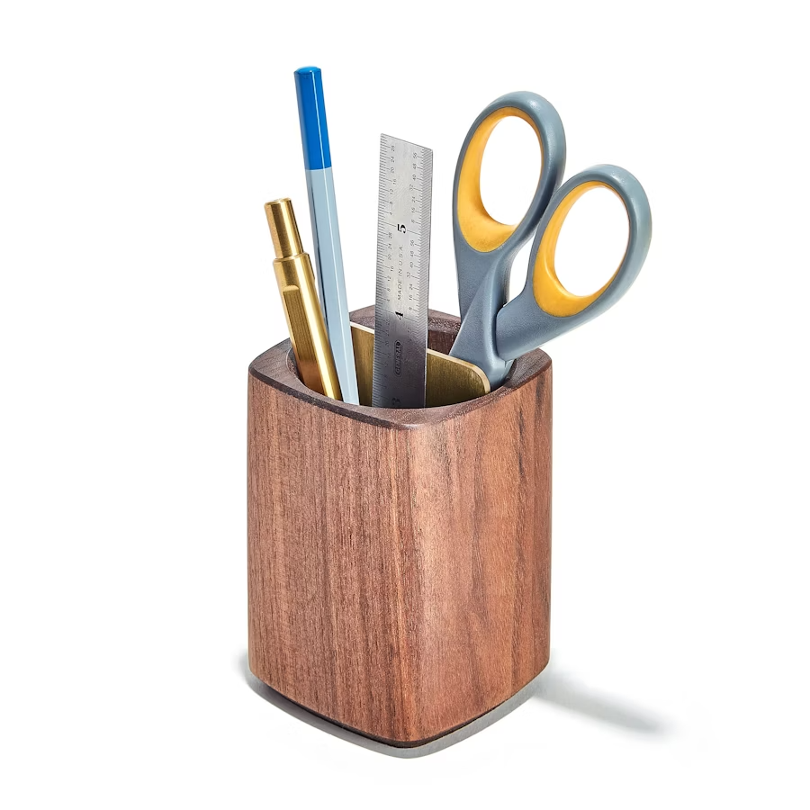 Pencils and supplies neatly organized in a wooden holder