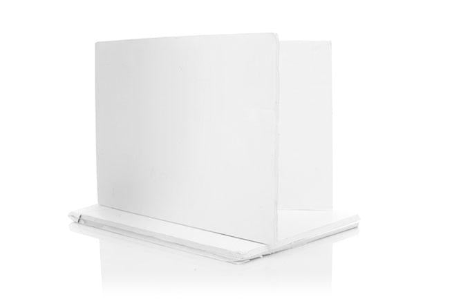 White foam board reflectors arranged in an L-shape on a white surface.