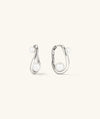 Dôme Figure Pearl Hoops featuring interwoven pearls of varying sizes on elegant hoops, ideal for versatile styling at any occasion.