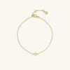 Lotus Bracelet: A gold chain bracelet featuring a diamond flower and a secure clasp, versatile for dressing up or down.