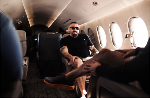 Andy sitting on a plane